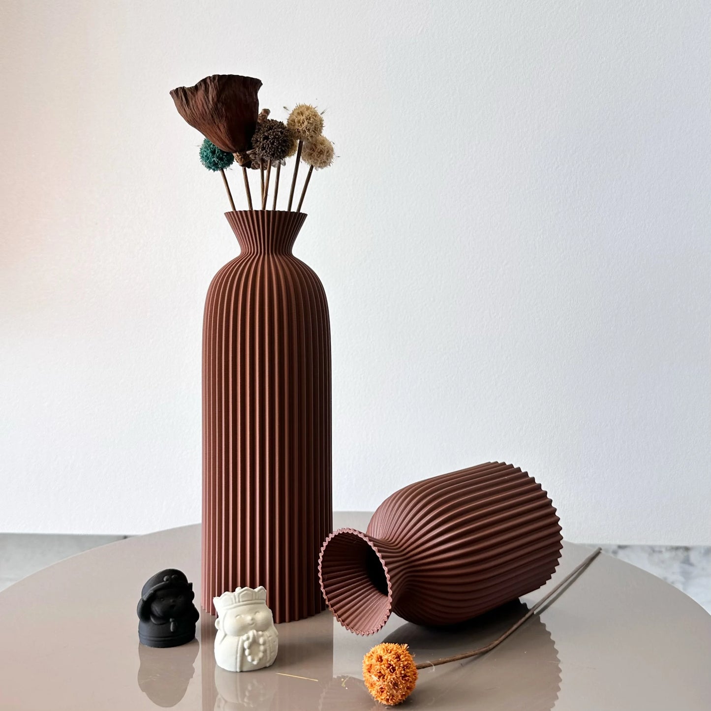 Brown textured vase with flowers on a white background