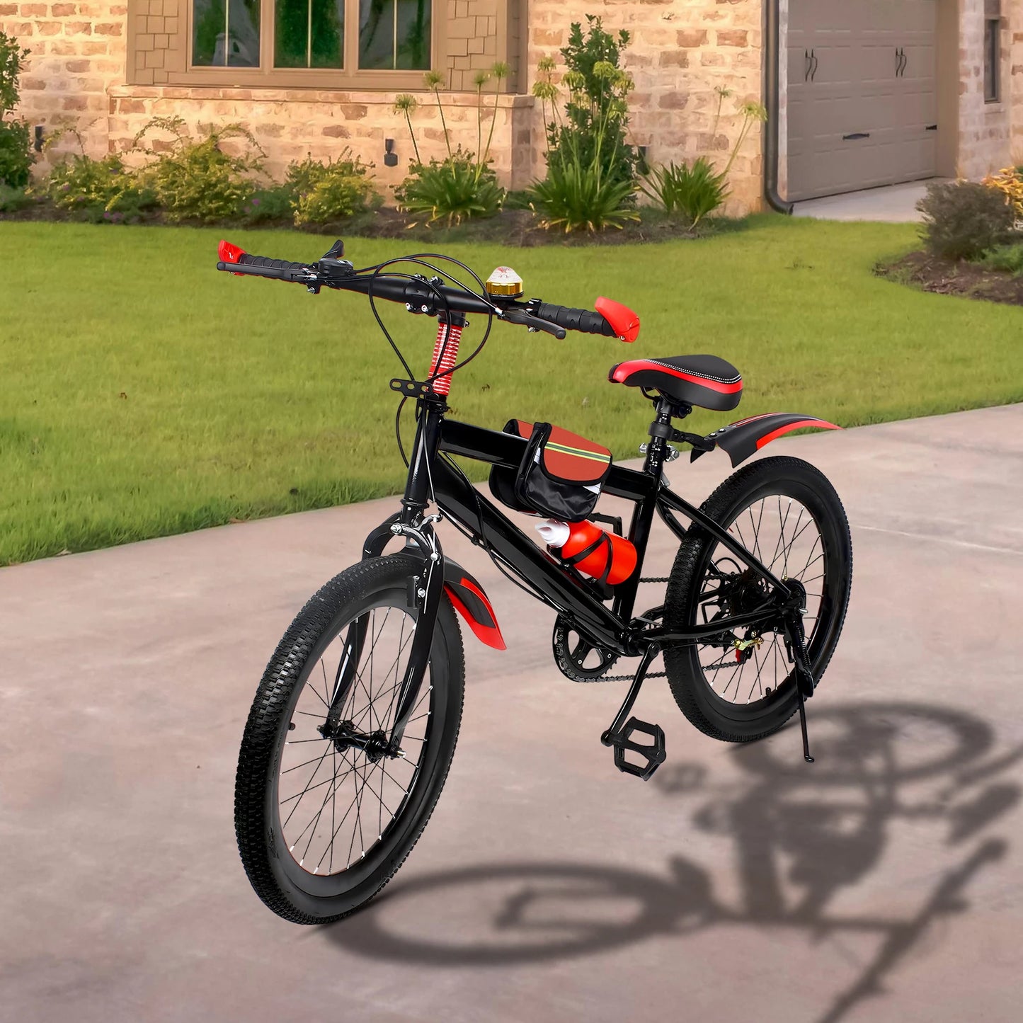 Black and red bicycle parked on a driveway in front of a house.