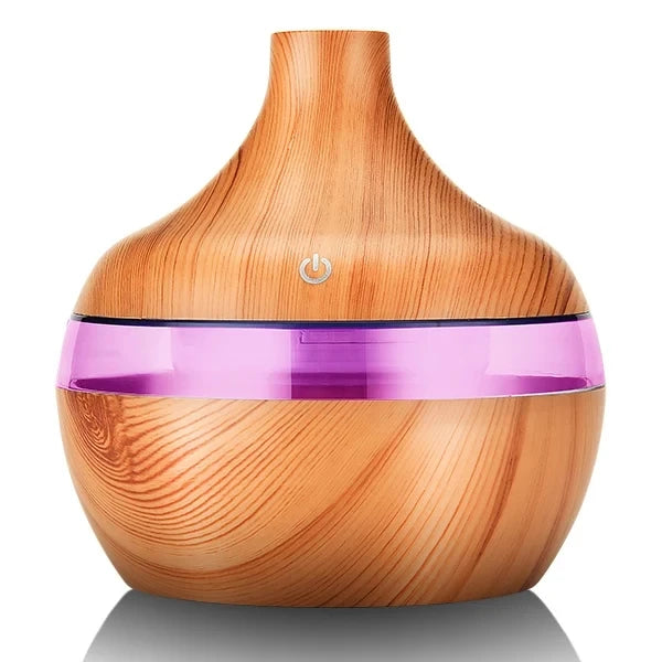 Wooden diffuser with a purple light band on a white background