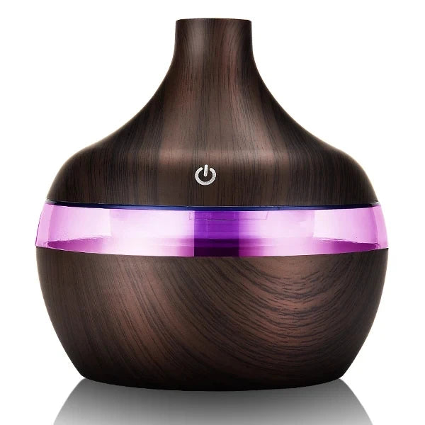 Wooden diffuser with a purple light band on a white background