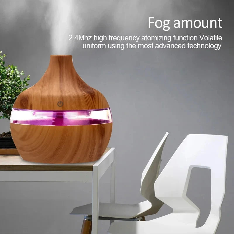 Wooden diffuser emitting fog with text about its features on a gray background