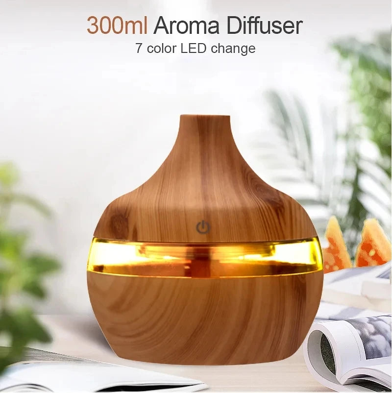 Wooden aroma diffuser with 7 color LED change on a blurred background