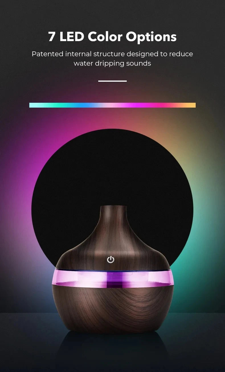 A diffuser with LED color options on a dark background
