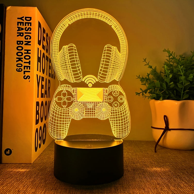 3D lamp shaped like a gaming controller with a plant and book in the background