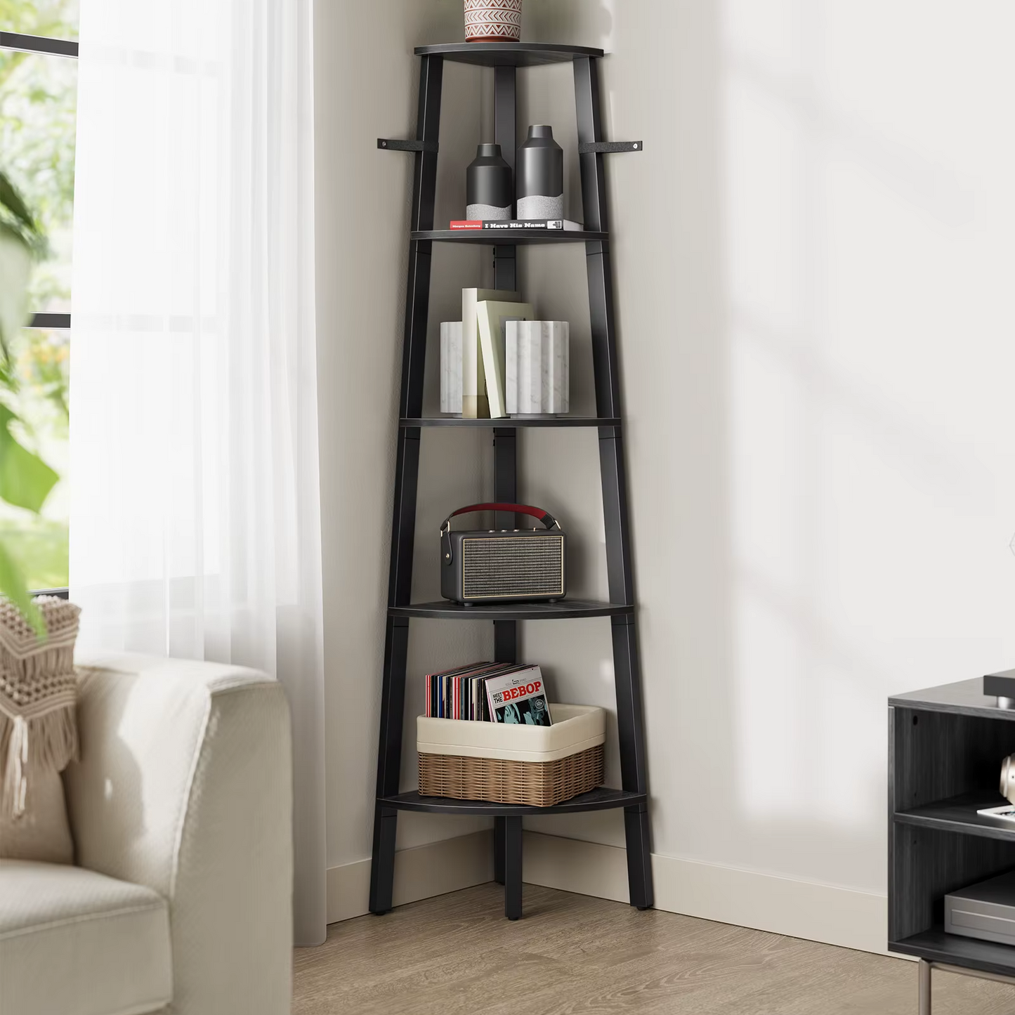 Corner shelf with books and decorative items in a living room setting