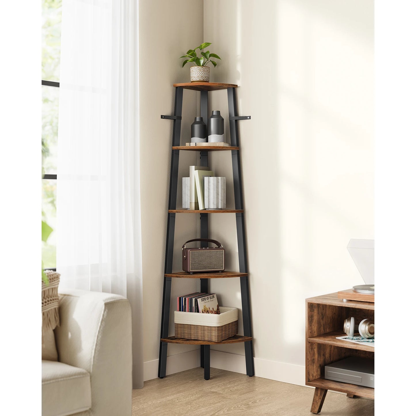 Wooden ladder shelf in a living room setting with decor items on each shelf.