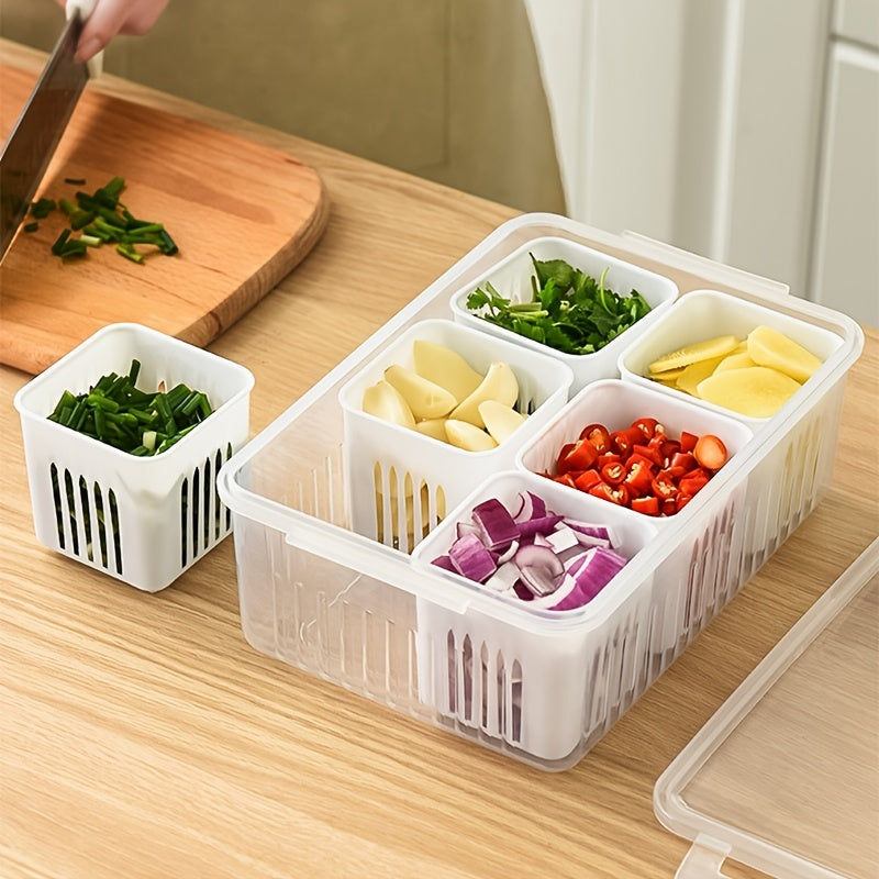 Clear plastic container with compartments filled with chopped vegetables on a wooden cutting board.