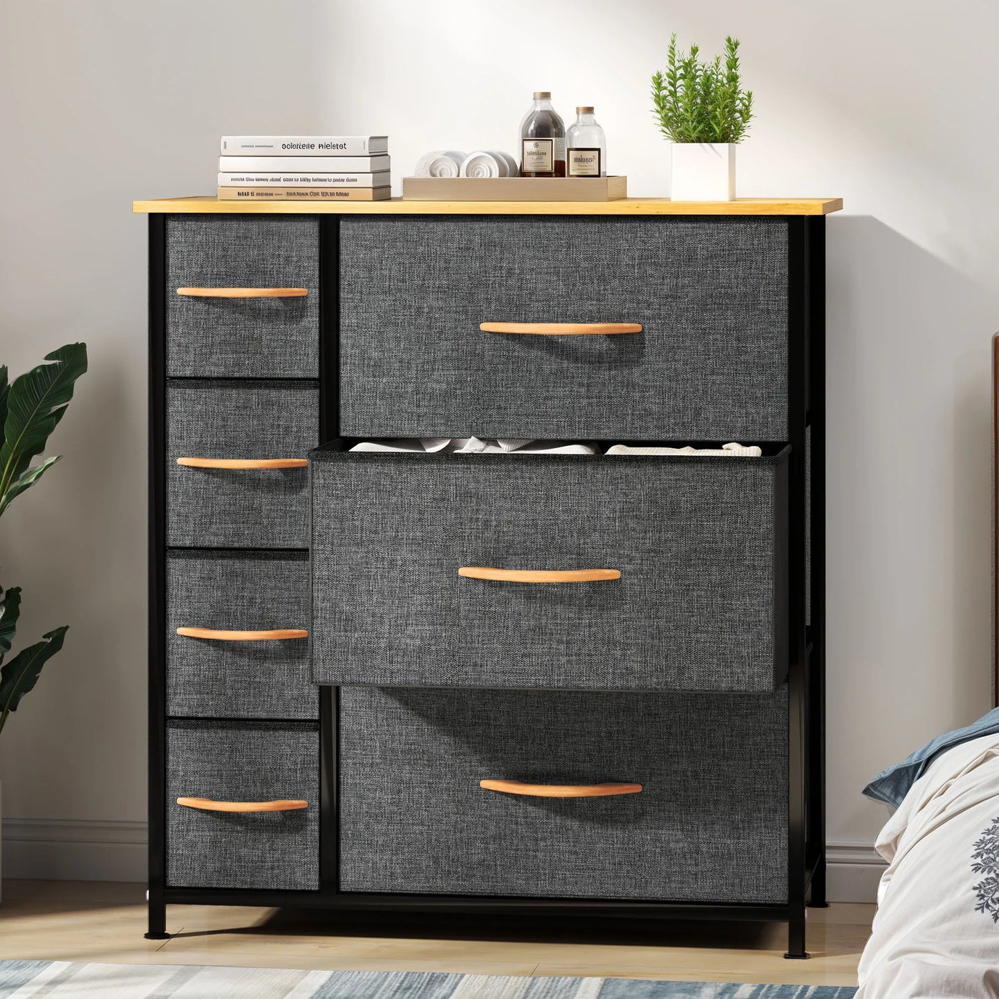 Gray dresser with wooden drawers in a room setting
