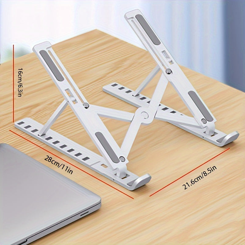 Foldable laptop stand on a wooden surface with dimensions indicated