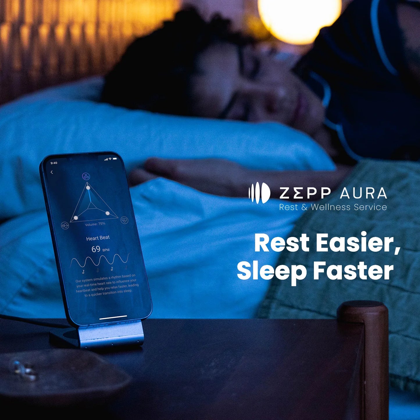 Person lying in bed with a smartphone displaying the Zepp Aura app, indicating rest and wellness service.
