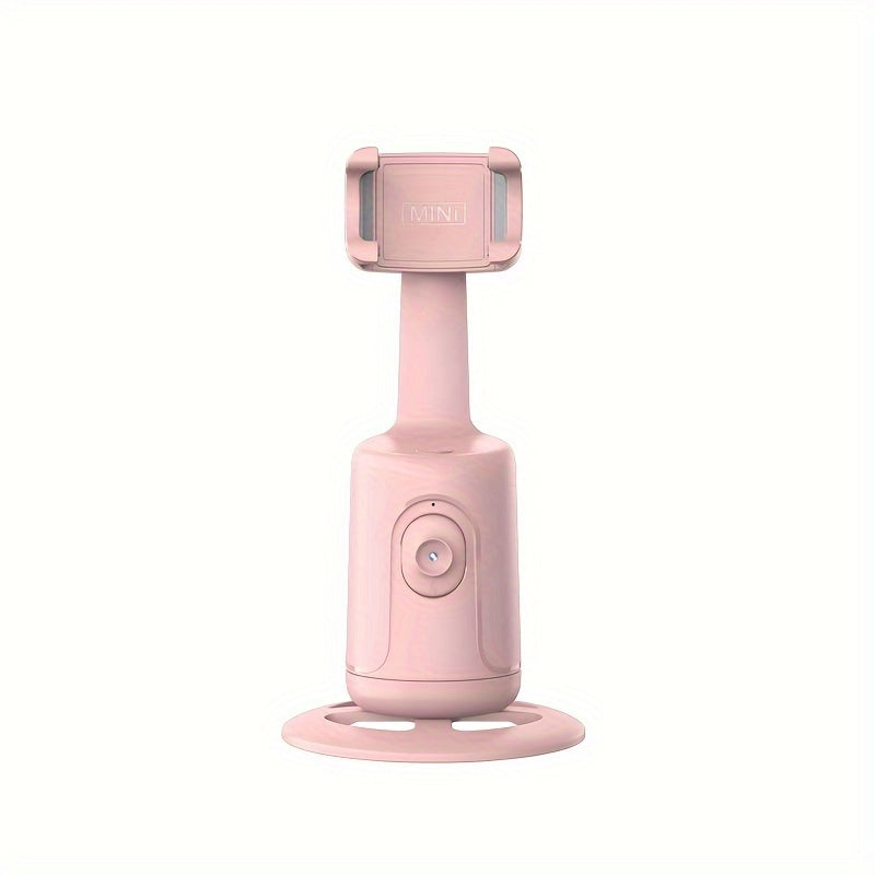 Pink handheld device with a stand on a white background