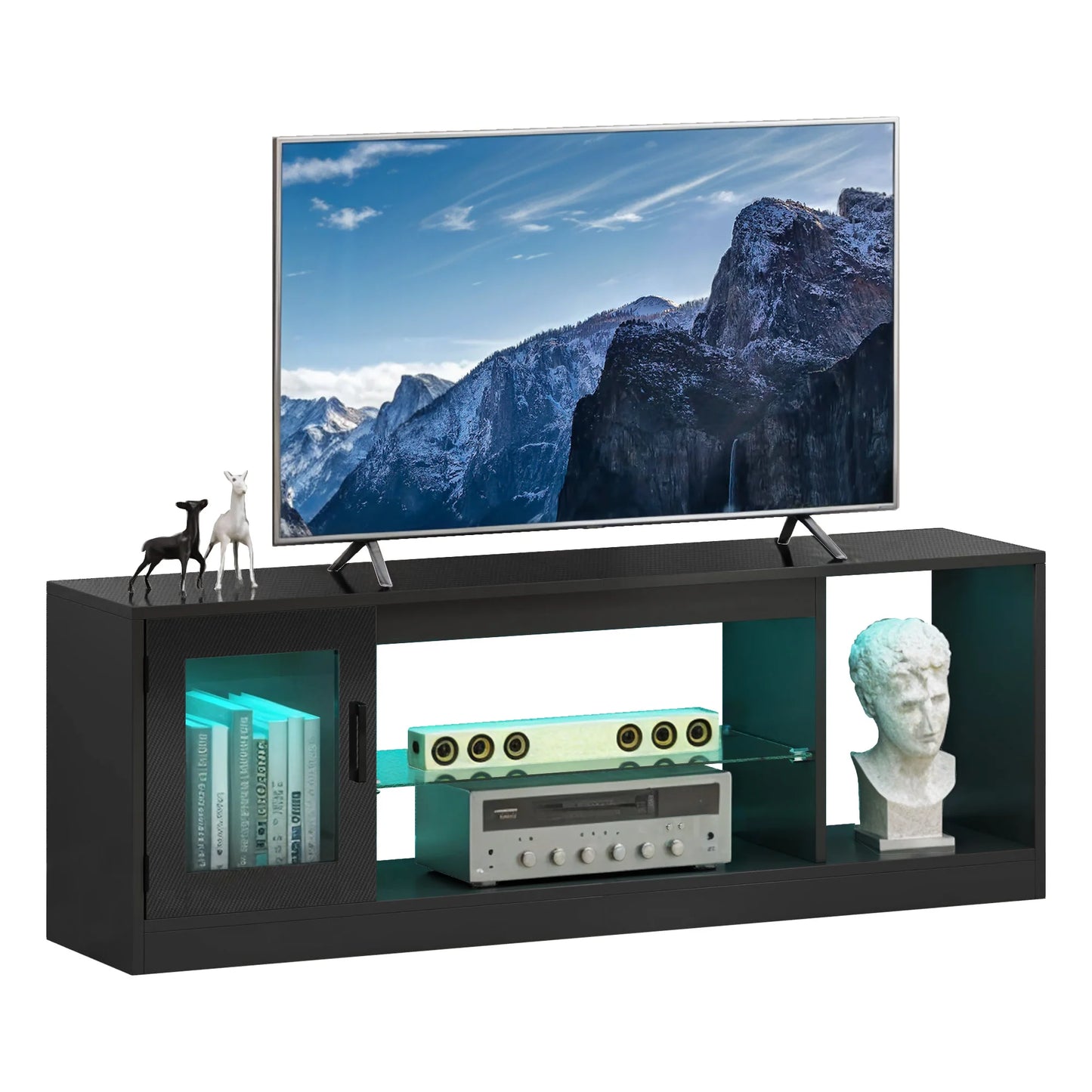Black TV stand with a television displaying a mountain scene, surrounded by decorative items.