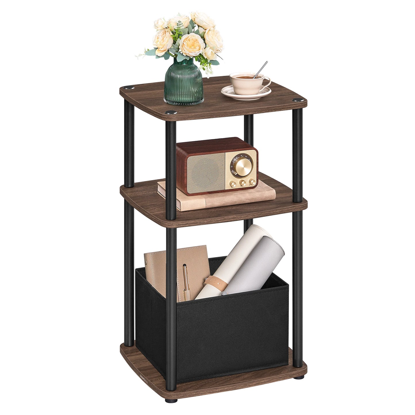 Three-tiered wooden side table with a radio, books, and a vase on a white background