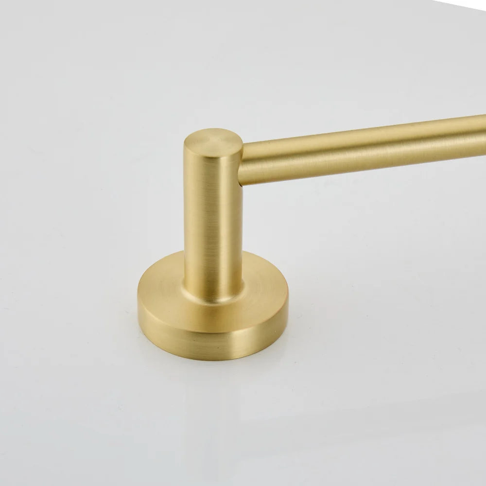 Gold towel bar on a light gray background