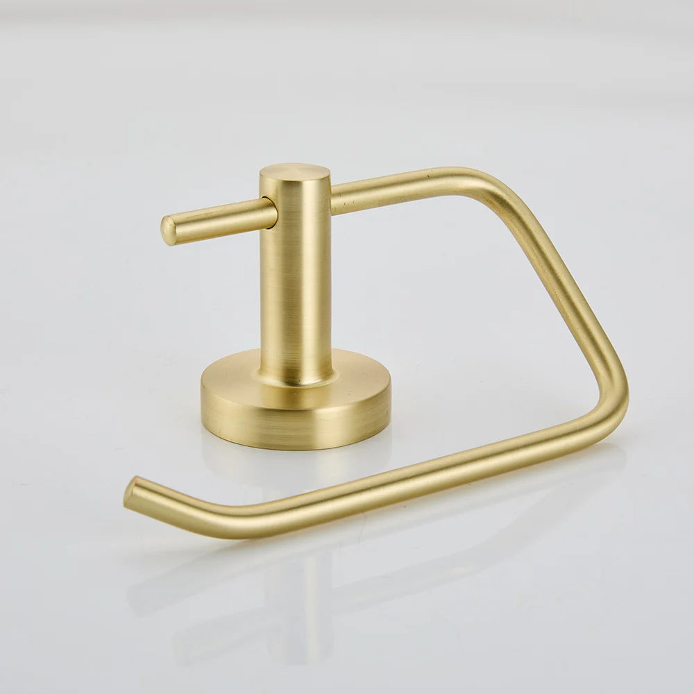 Gold toilet paper holder on a light gray background