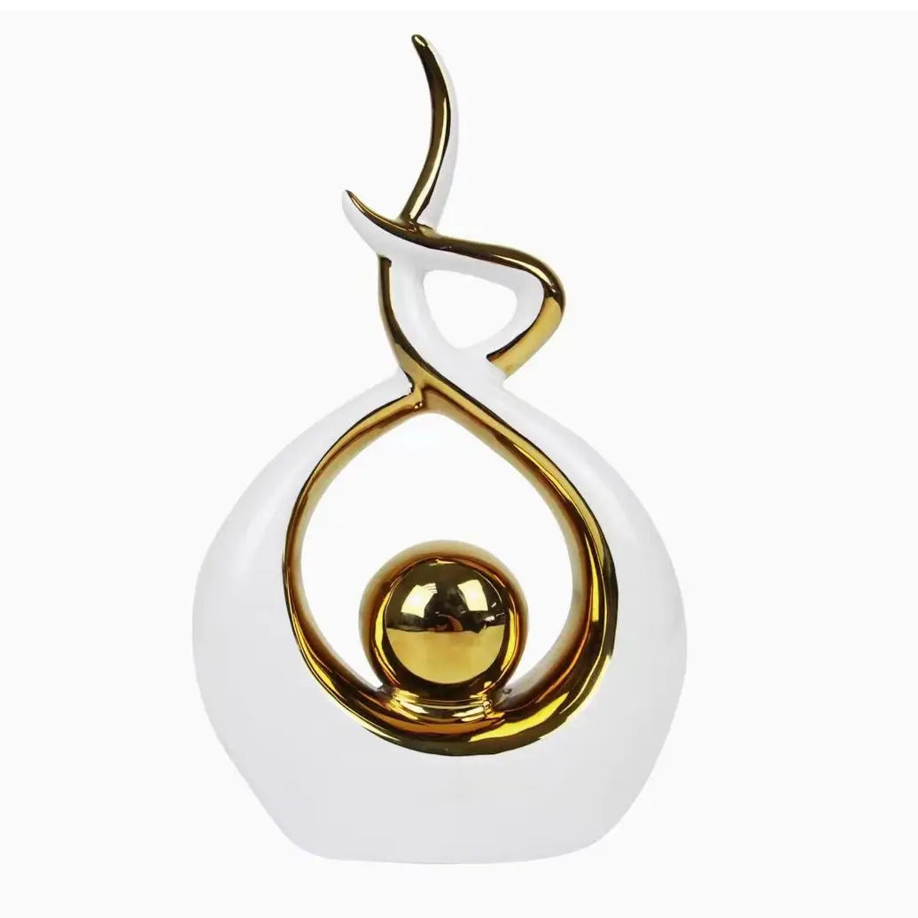 Decorative object with white base and gold circular design on a white background