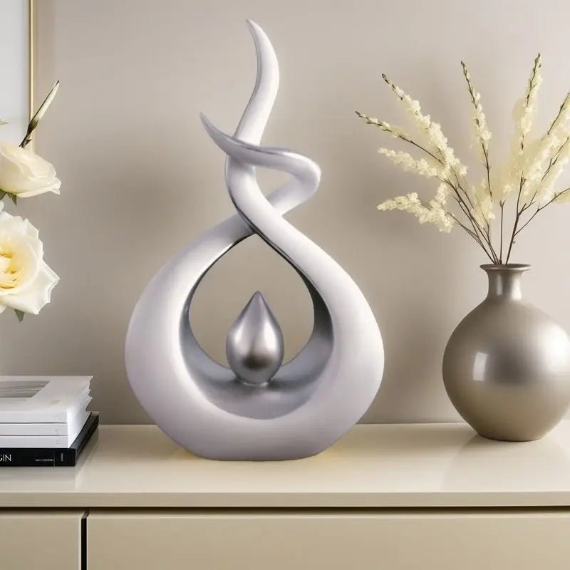 Decorative sculpture on a shelf with books and a vase in the background