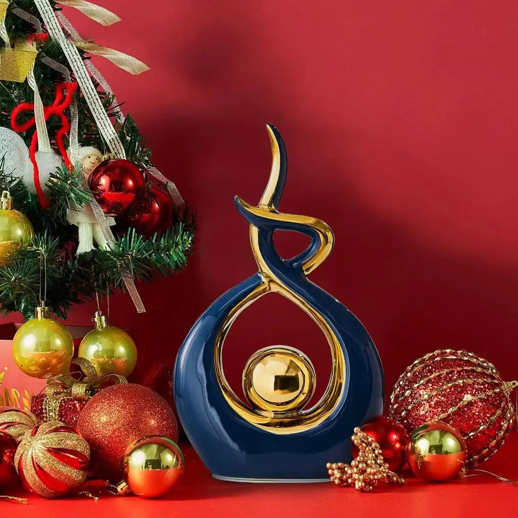 Decorative blue and gold ornament on a red background with Christmas tree and ornaments.