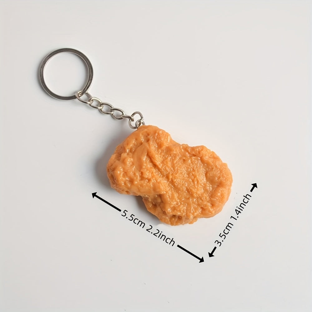 Orange keychain with measurements on a white background