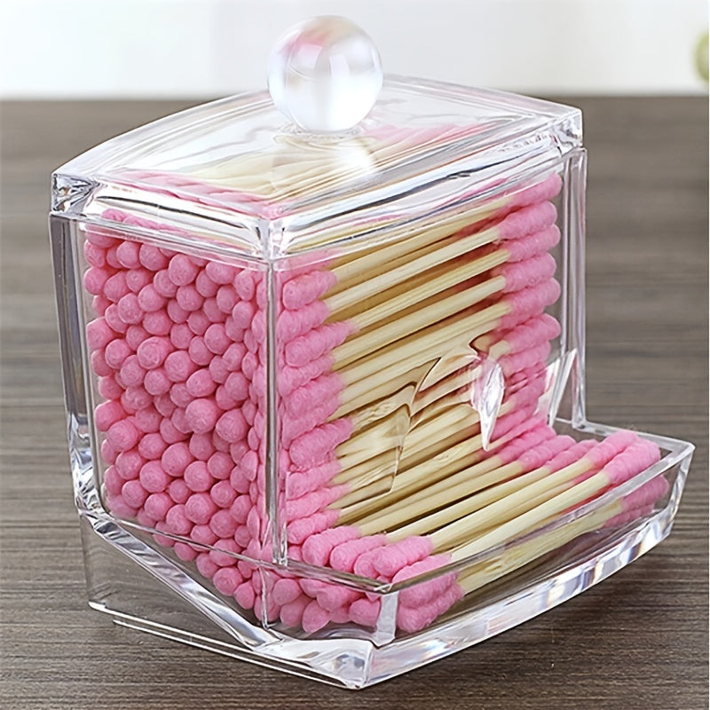 Clear hexagonal container with pink and beige toothpicks on a wooden surface