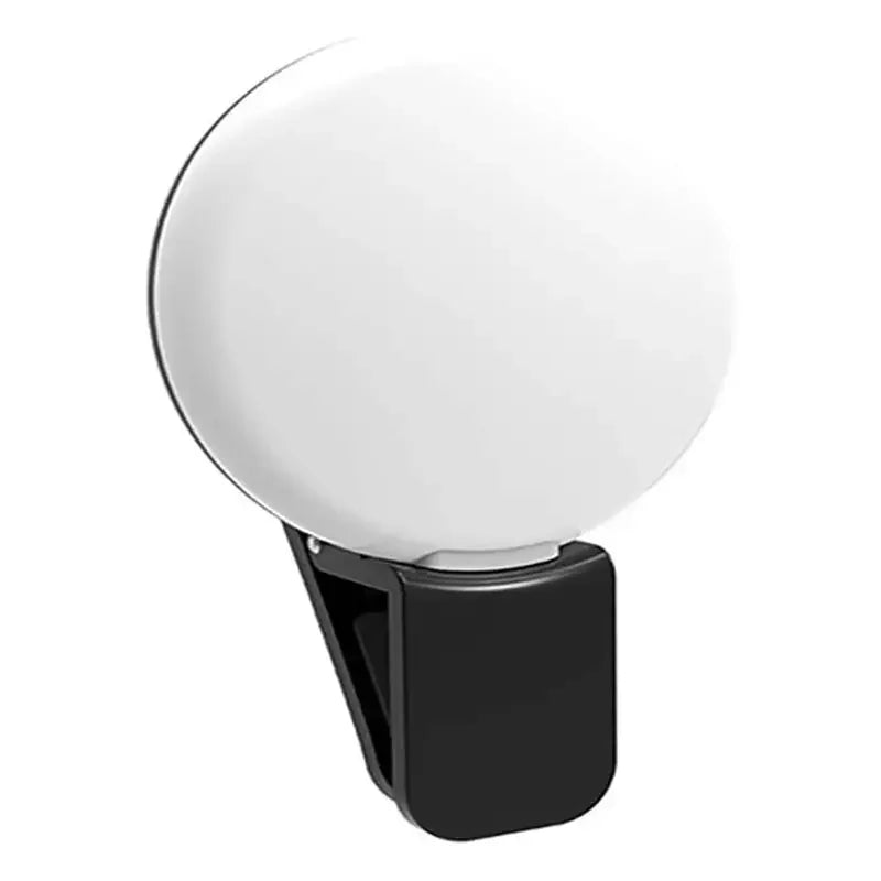 Black clip with a white spherical object on a white background