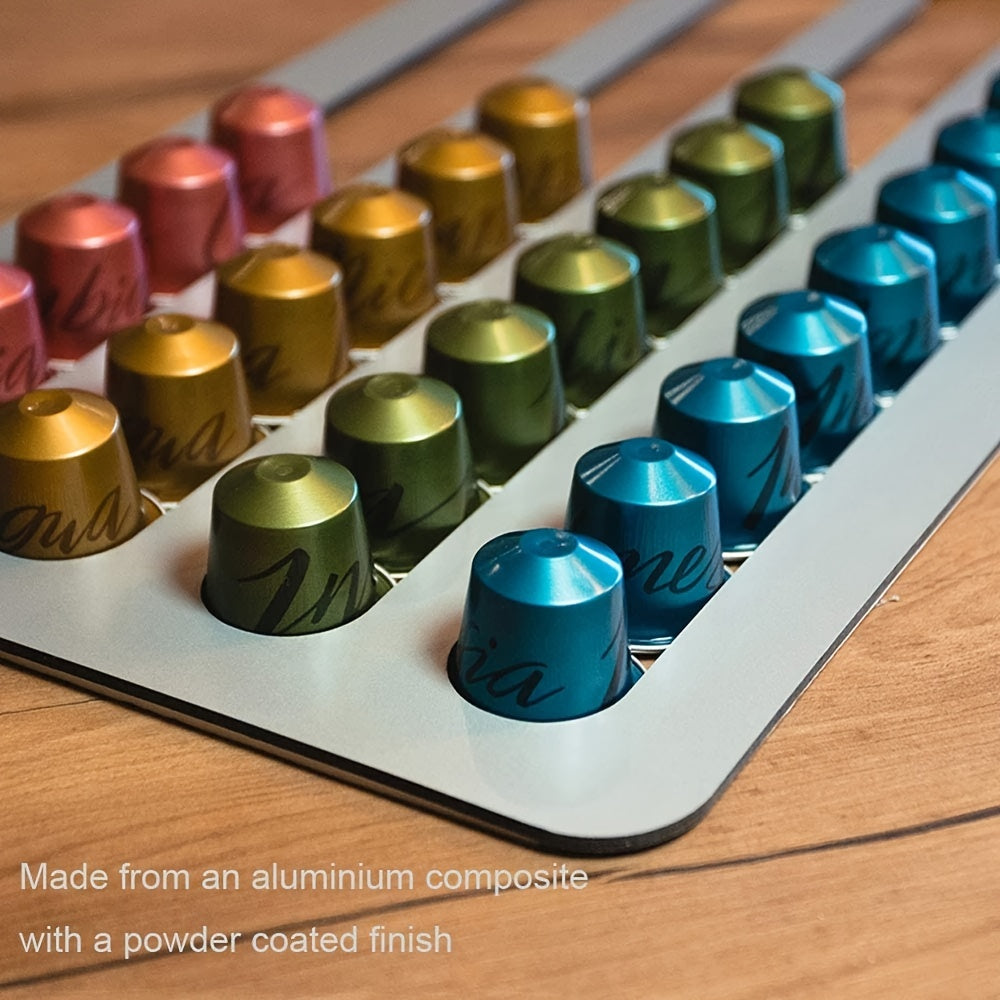 Colorful metal capsules arranged in a tray on a wooden surface.
