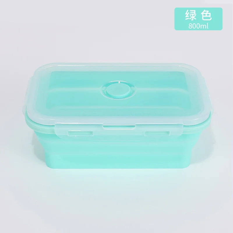 Green silicone container with a lid on a light gray background