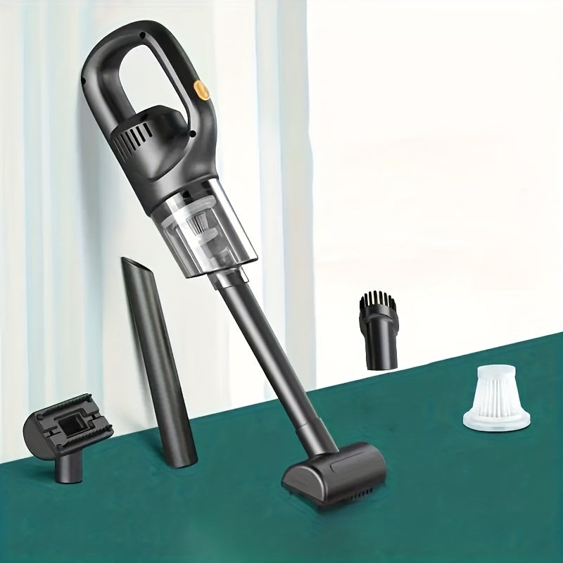 Handheld vacuum cleaner with attachments on a green surface