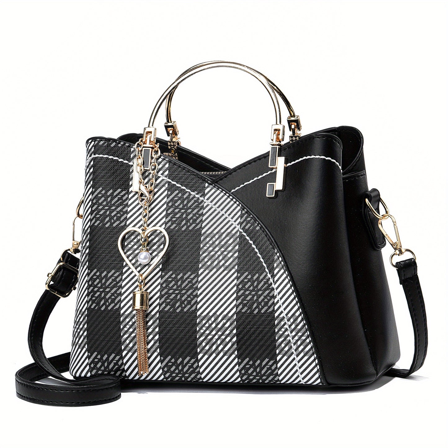 Black and white plaid handbag with gold accents on a white background