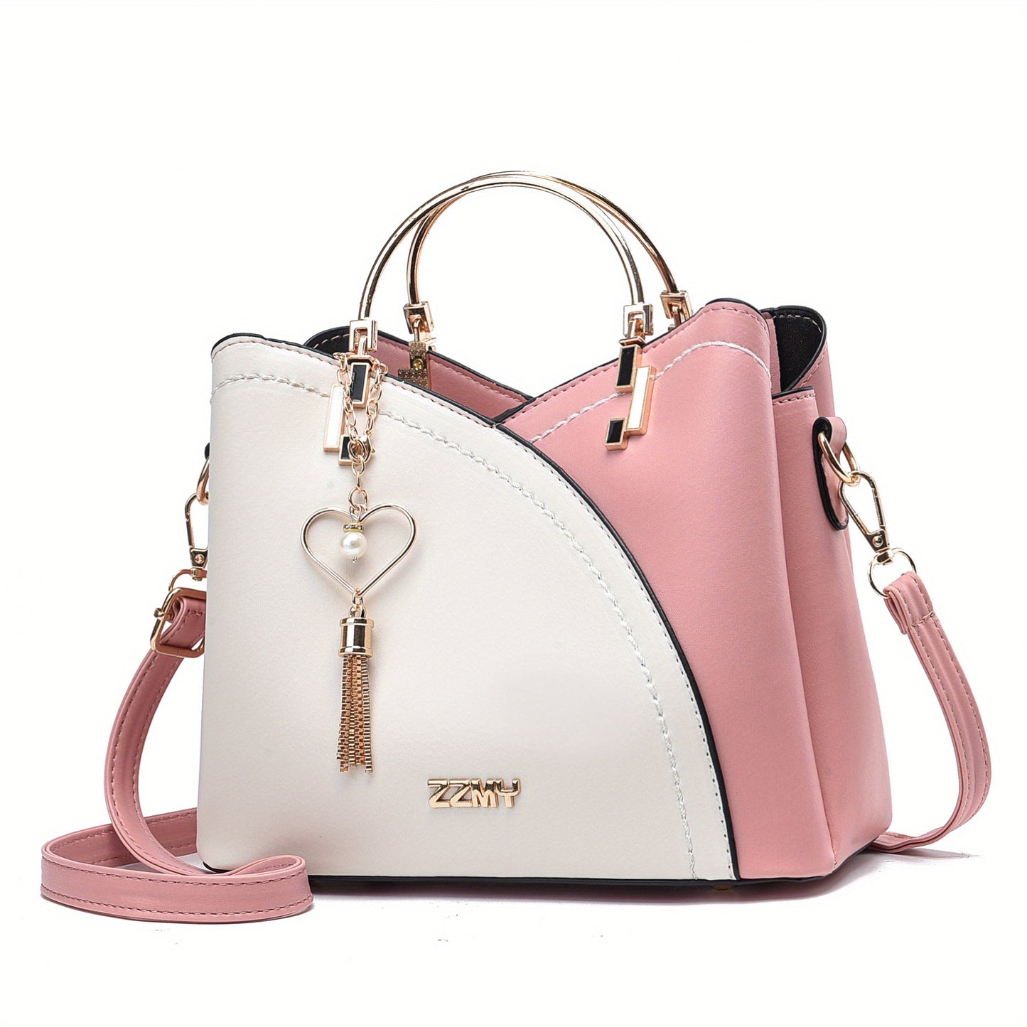 Pink and white handbag with a heart-shaped charm on a white background
