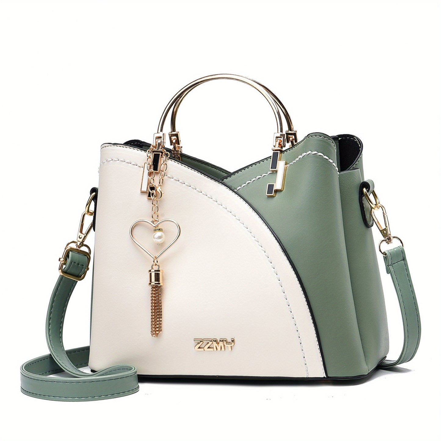 Green and white handbag with a heart-shaped keychain on a white background