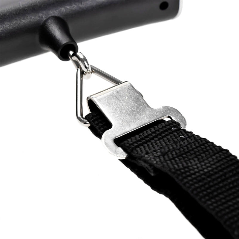 Close-up of a black strap with a metal buckle on a white background