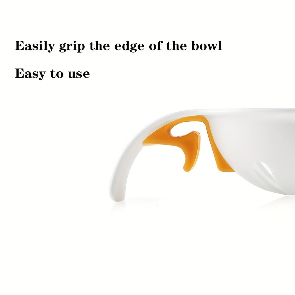White bowl with orange handle on a white background