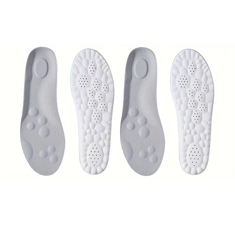Two pairs of white shoe insoles on a white background