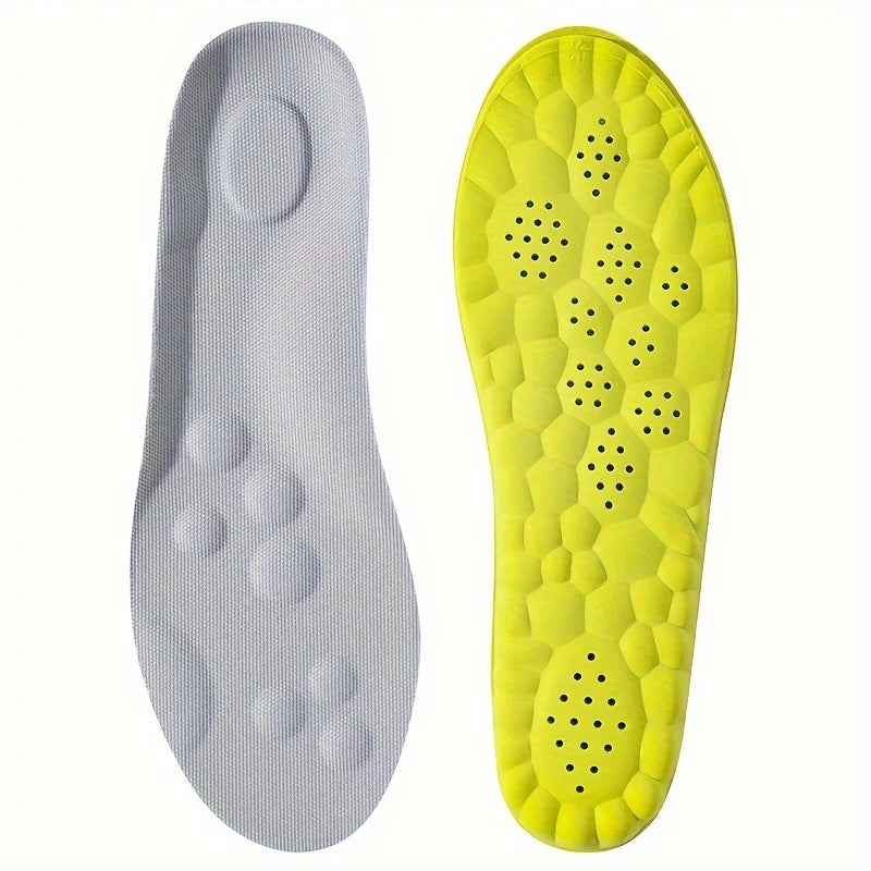 Gray and yellow shoe insoles on a white background