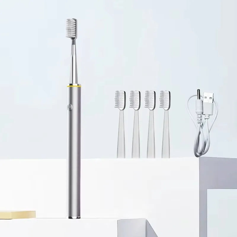 Electric toothbrush with multiple brush heads and a charging cable on a light gray background