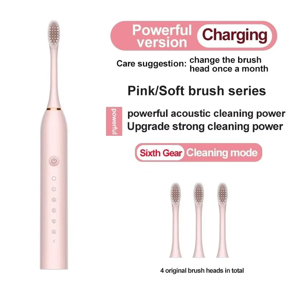 Pink electric toothbrush with charging features and brush heads on a white background