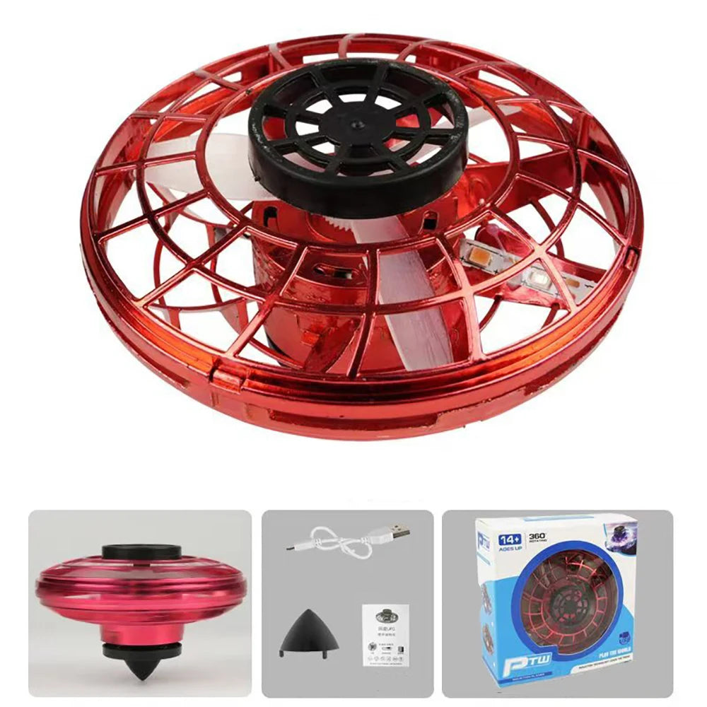 Red and black toy drone with packaging and accessories on a white background