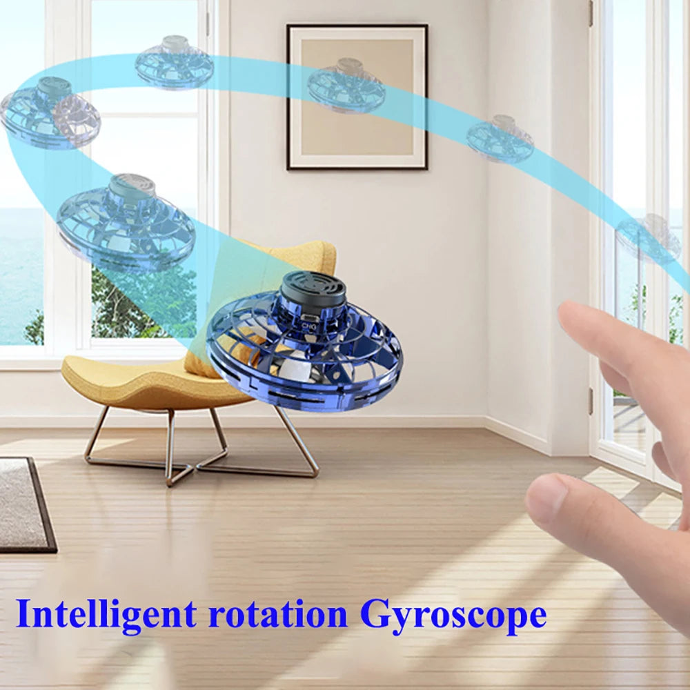 Blue gyroscope toy with a hand interacting in a room setting, labeled 'Intelligent rotation Gyroscope'.