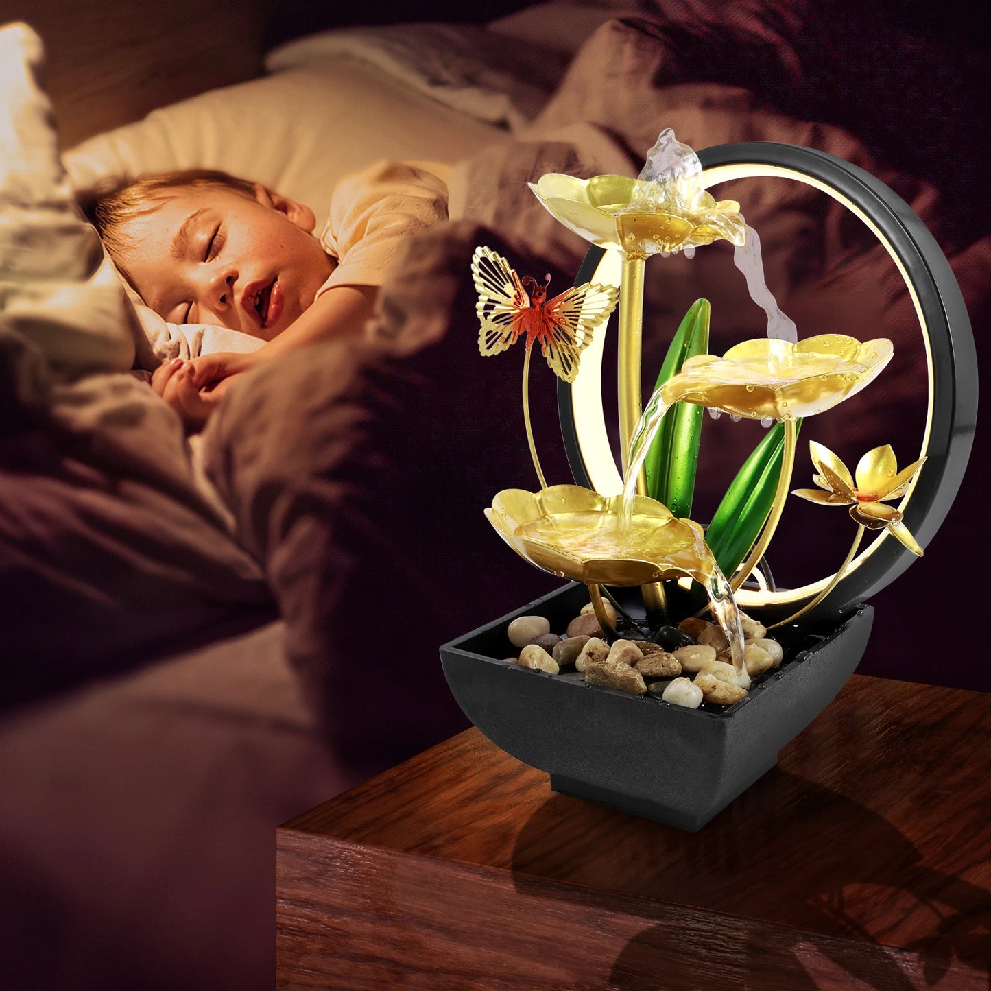 Decorative lamp with flowers and butterflies on a bedside table next to a sleeping child.