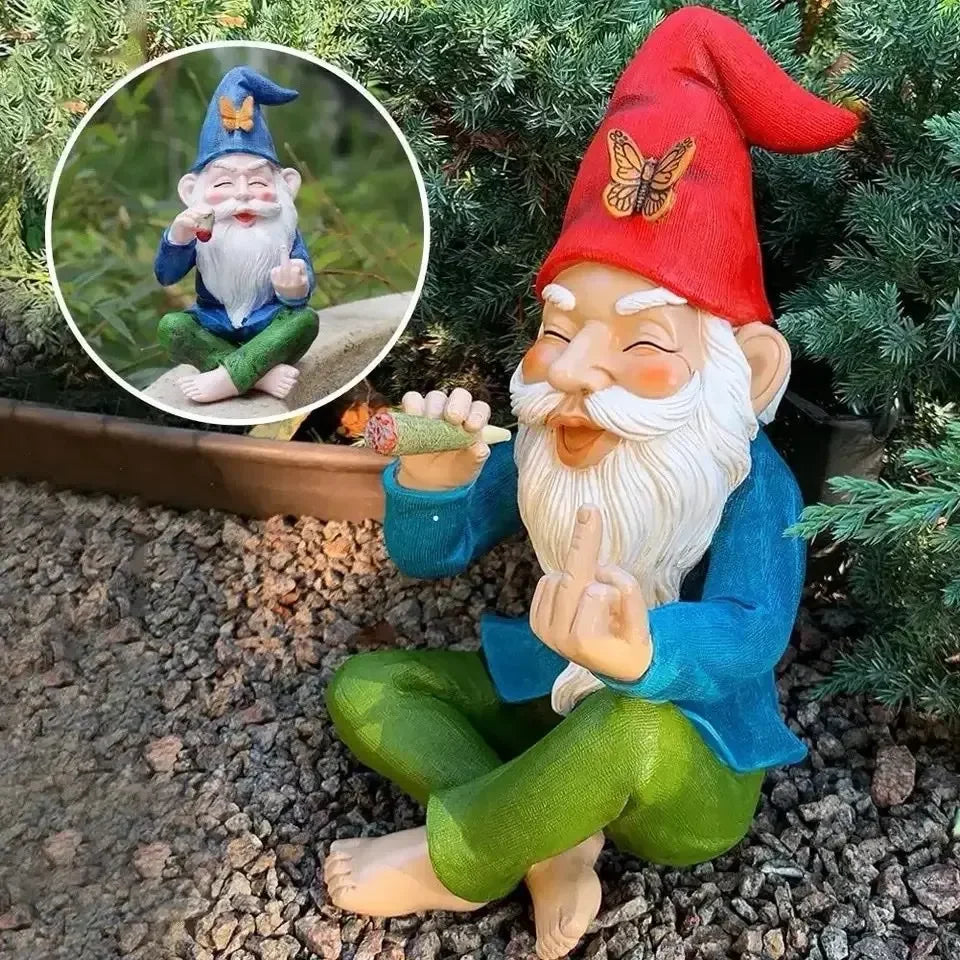 Gnome figurine with a red hat and blue coat sitting on ground with inset showing close-up.