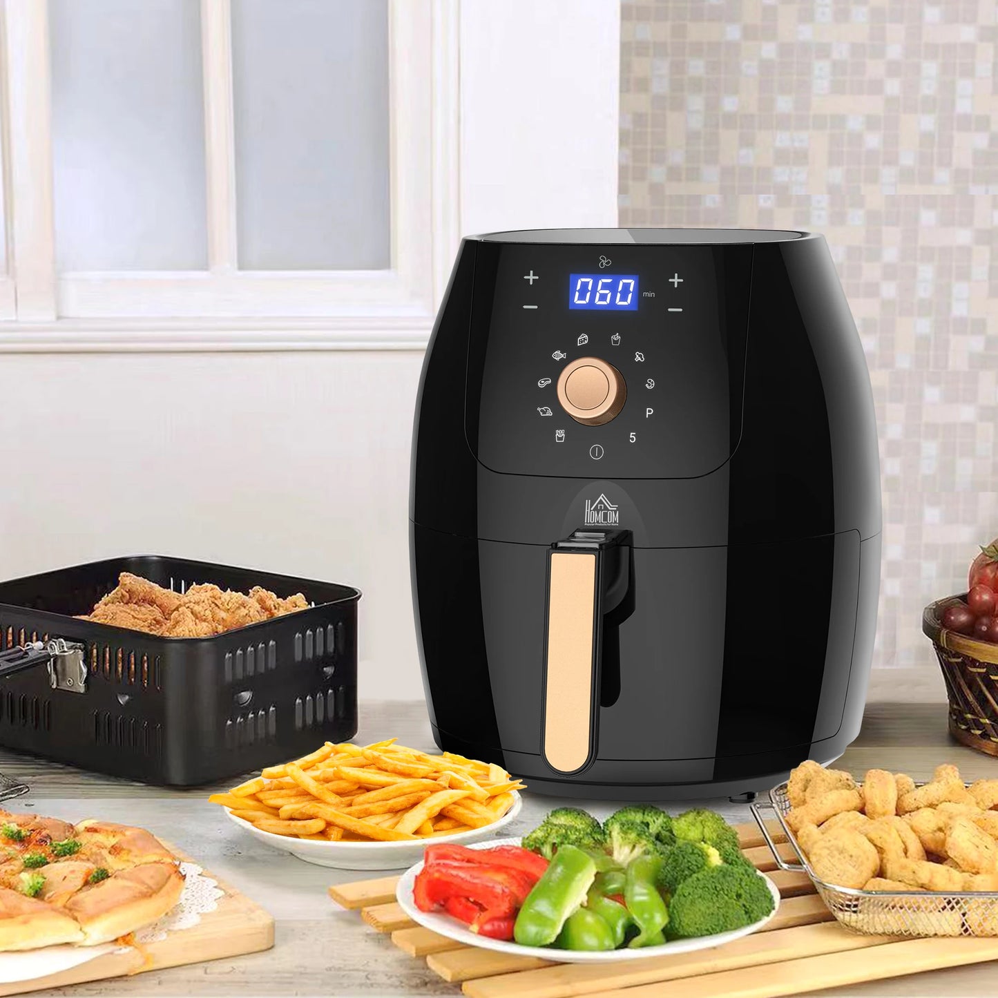 Black air fryer on a kitchen counter with various foods around it.