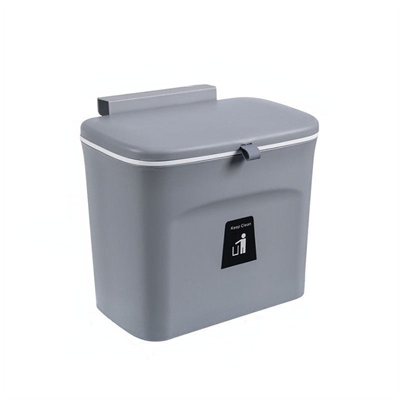 Gray wall-mounted trash can with a lid on a white background
