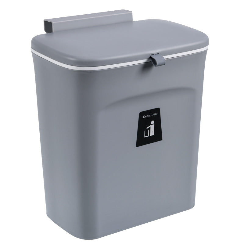 Gray trash bin with a lid on a white background