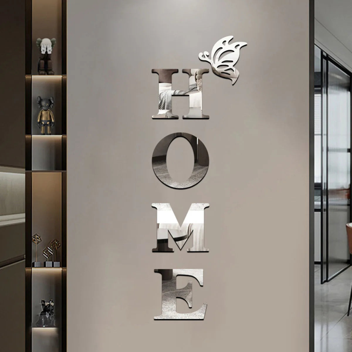 Decorative wall art with 'HOME' letters and a logo on a neutral wall.