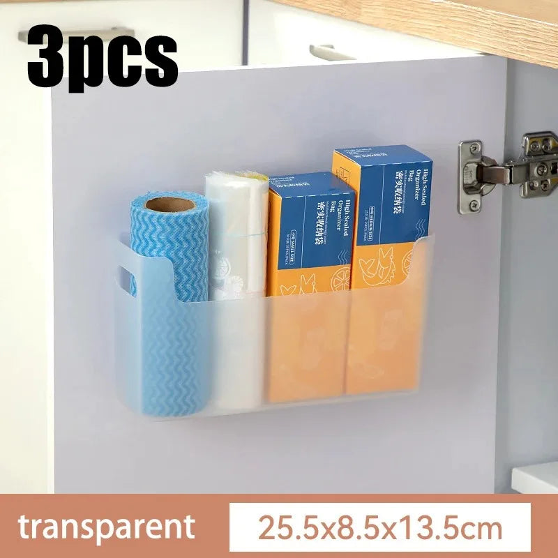 Cabinet organizer with three compartments holding a roll, box, and other items, with dimensions displayed.