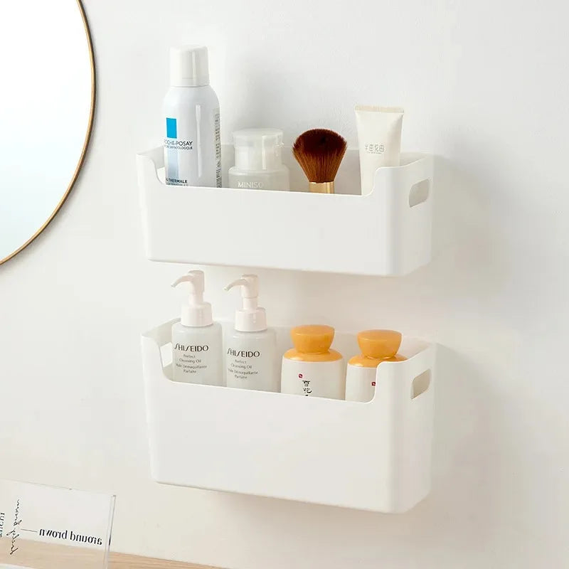 White wall-mounted storage baskets with skincare products on a light gray wall.