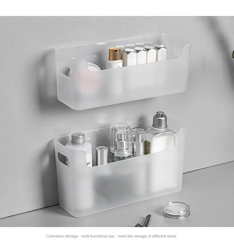 White wall-mounted storage baskets with cosmetic items on a neutral background