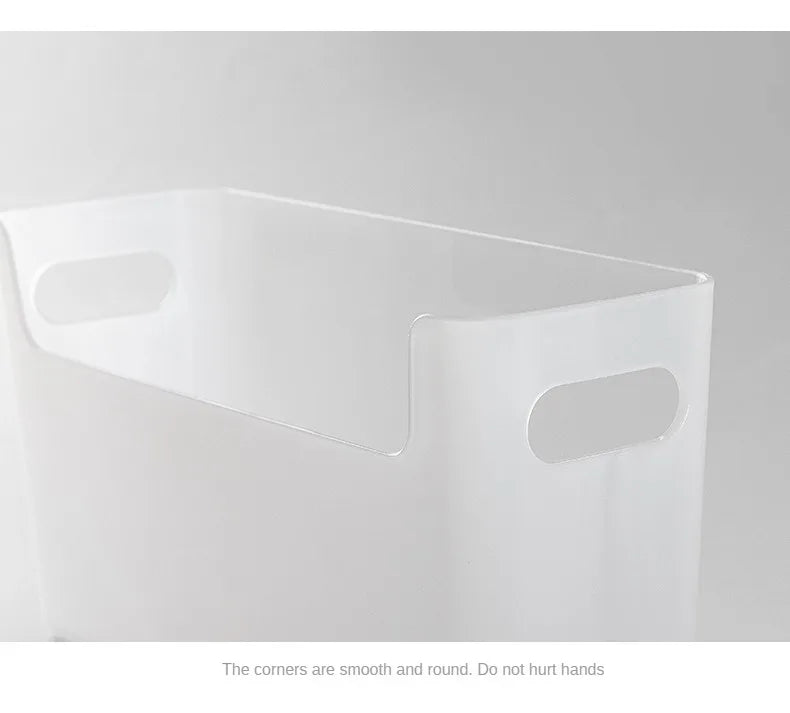 Clear plastic storage box with rounded corners on a gray background