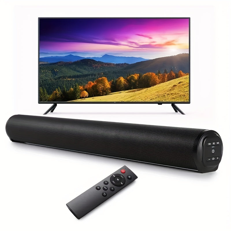 Black soundbar with remote control in front of a TV displaying a scenic landscape.